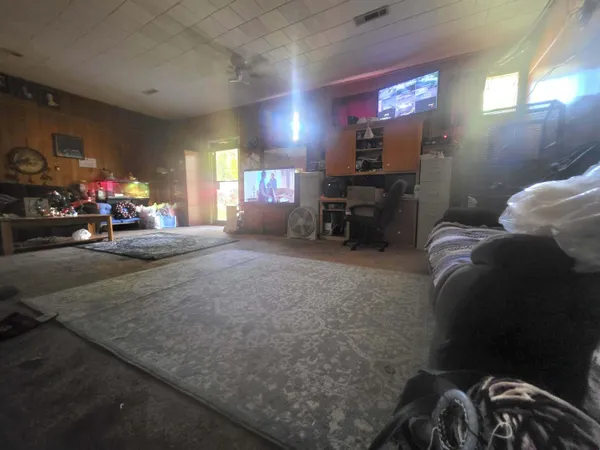 a view of a livingroom with furniture and toys