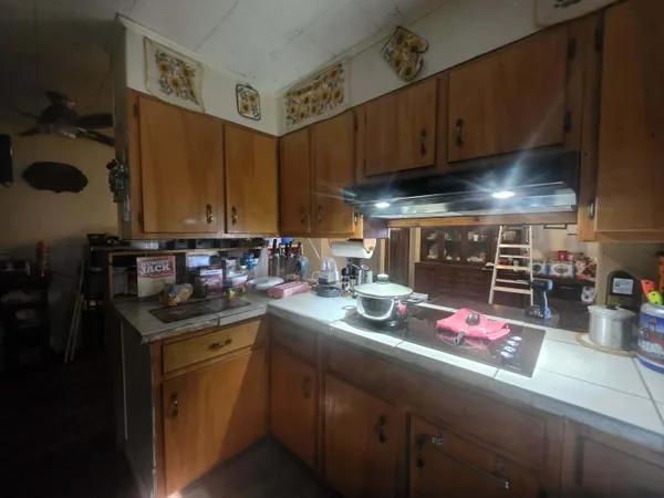 a kitchen with stainless steel appliances granite countertop a sink dishwasher stove and cabinets