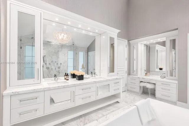 a bathroom with a tub sink and mirror