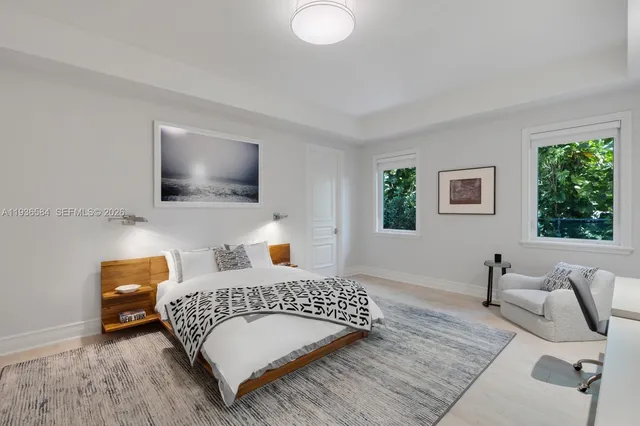 a bedroom with a bed and couch