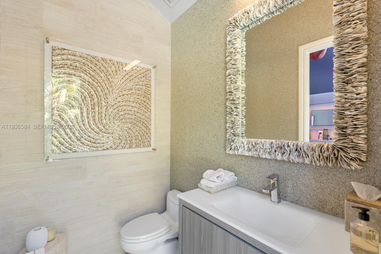 761 Buttonwood Lane Miami, FL 33137 - Photo 35 of 55 a bathroom with a sink and a toilet