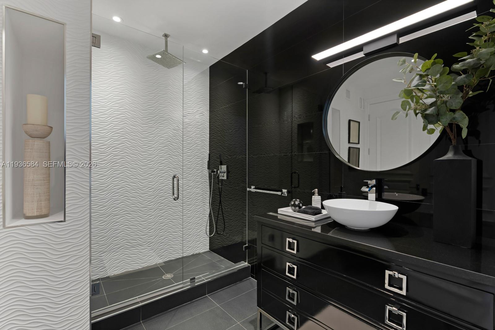 761 Buttonwood Lane Miami, FL 33137 - Photo 42 of 55 a bathroom with a sink mirror and vanity