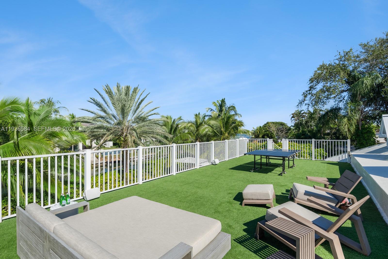 761 Buttonwood Lane Miami, FL 33137 - Photo 43 of 55 a view of a backyard with sitting area