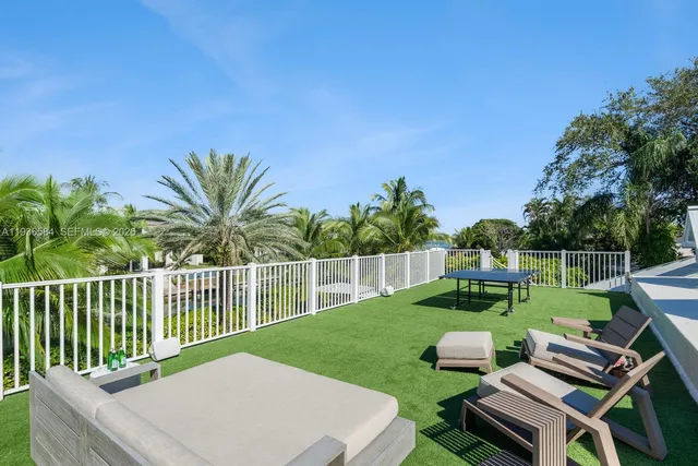a kitchen with stainless steel appliances kitchen island granite countertop a sink and cabinets