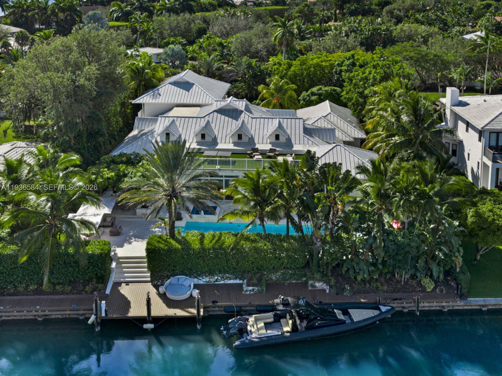 761 Buttonwood Lane Miami, FL 33137 - Photo 47 of 55 an aerial view of a house with a garden and lake view