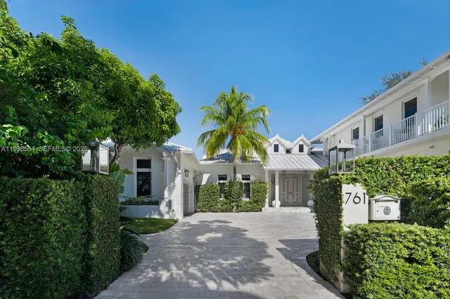a view of a city with lots of residential buildings lake and ocean view