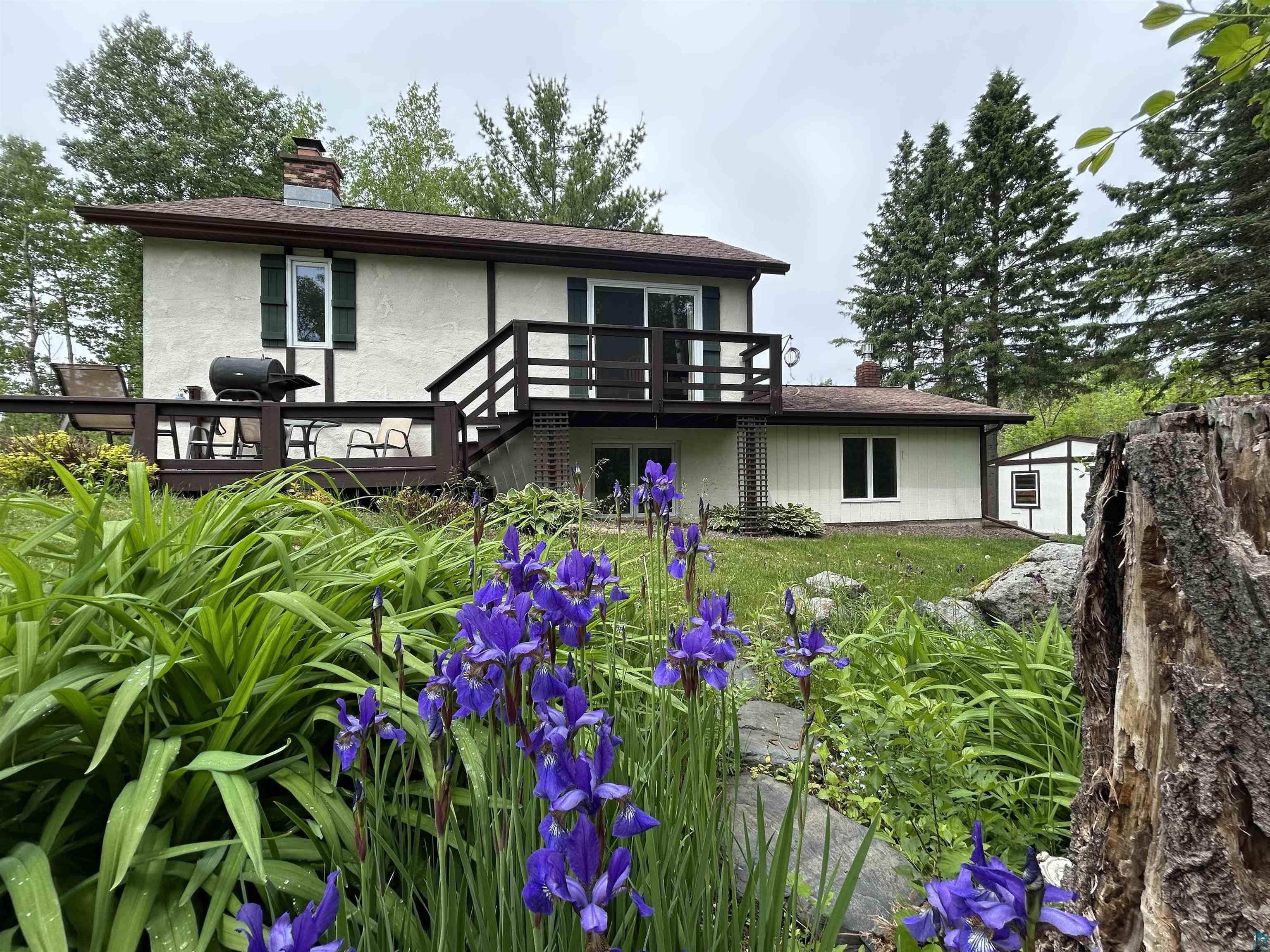 3616 Lavaque Road Hermantown, MN 55811 - Photo 10 of 43 Exterior with stucco siding, dark trim, and a brown shingle roof