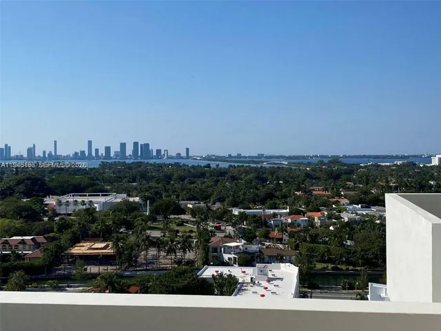 a dining room with furniture window and wooden floor