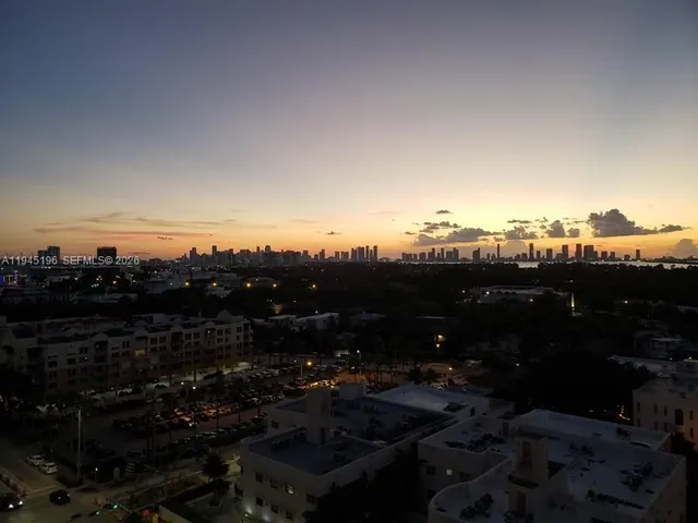 a view of a pathway with a wrought fence