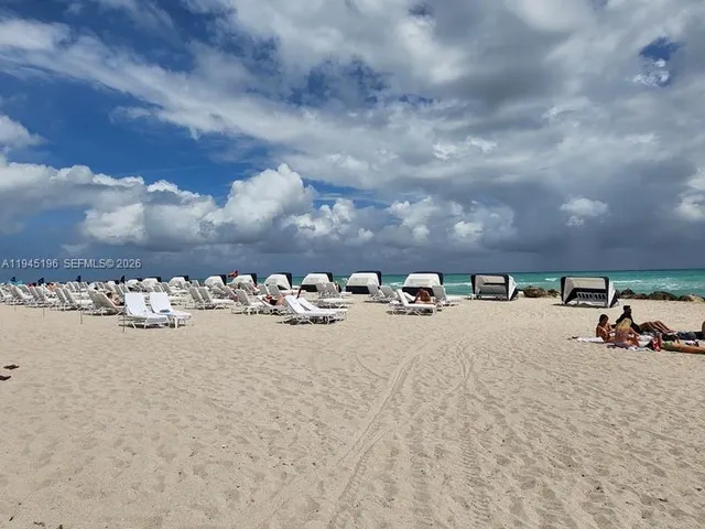 a view of building with yard and street view