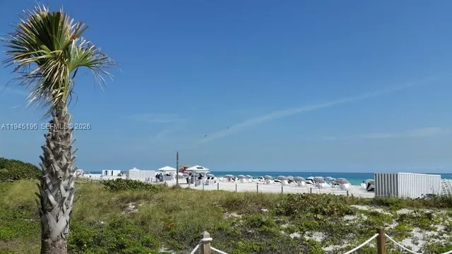 an aerial view of a city with ocean view