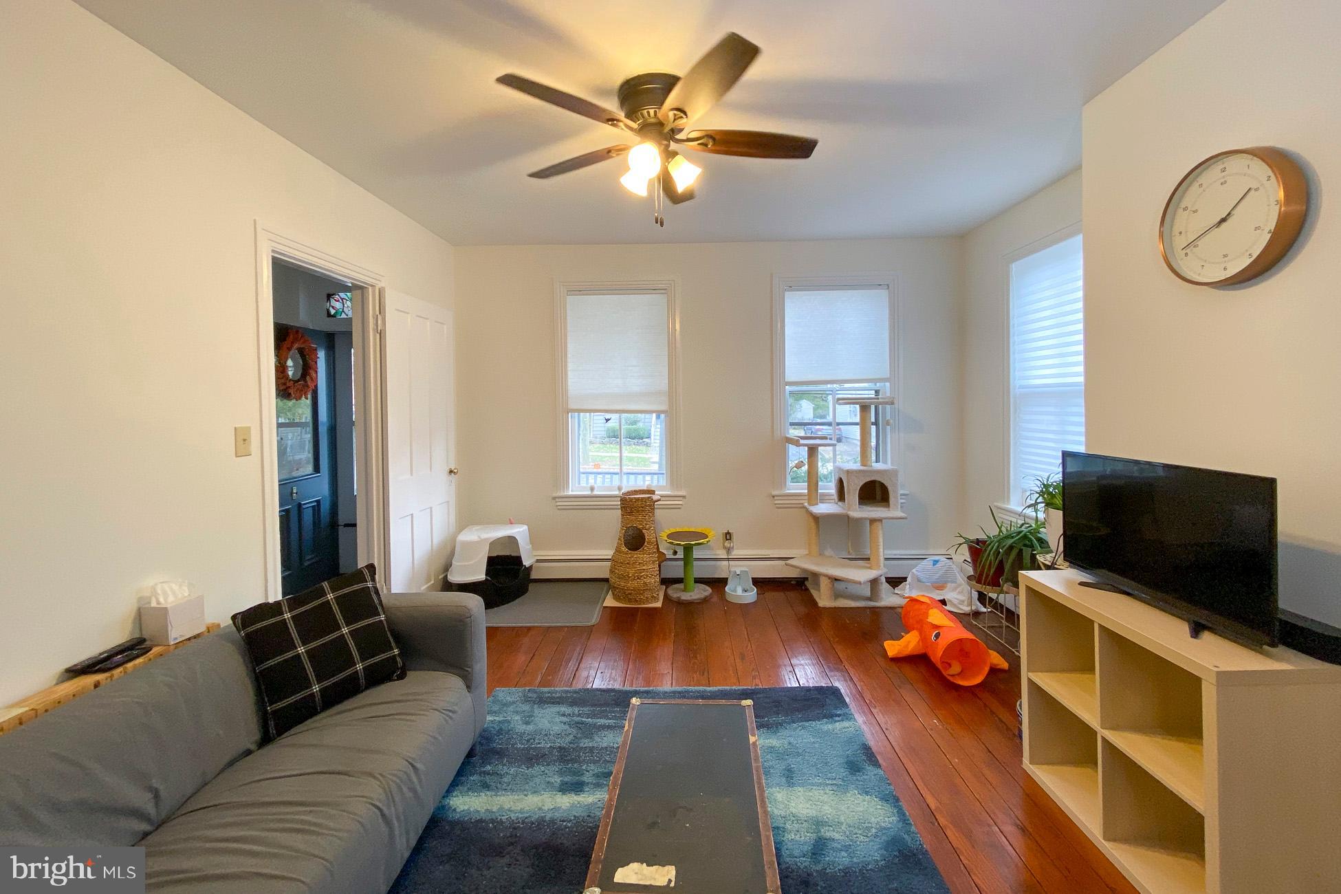 10 Princeton Avenue Hopewell, NJ 08525 - Photo 6 of 20 a living room with furniture and a flat screen tv