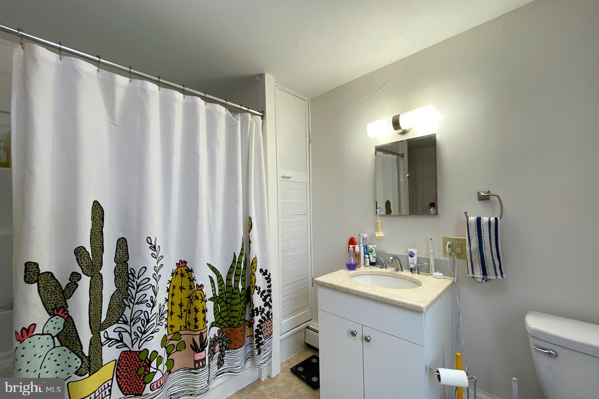 10 Princeton Avenue Hopewell, NJ 08525 - Photo 9 of 20 a bathroom with a sink mirror and vanity