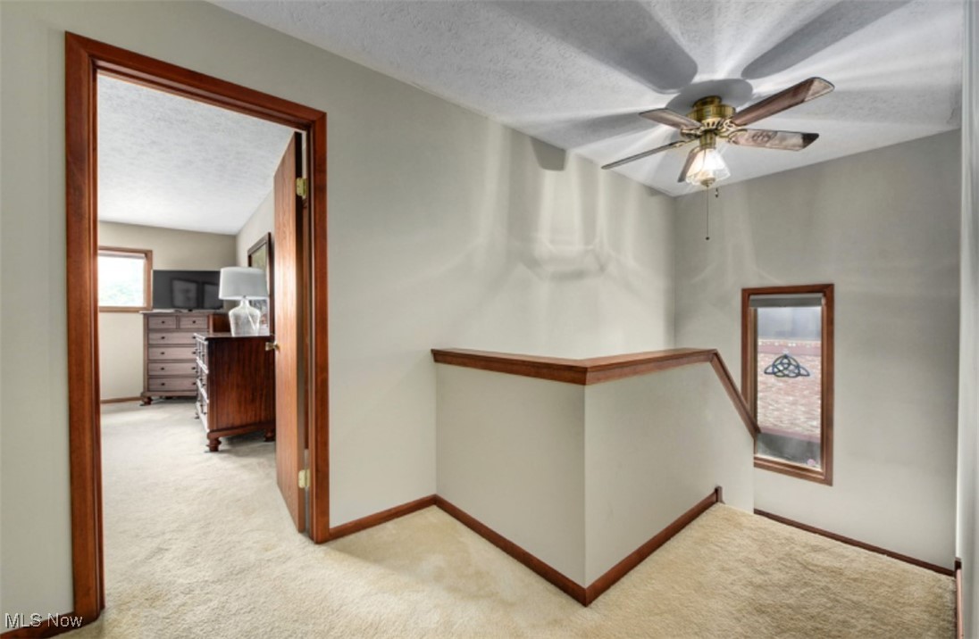 22536 Center Ridge Road, Unit A Rocky River, OH 44116 - Photo 20 of 32 upstairs hall with light carpet