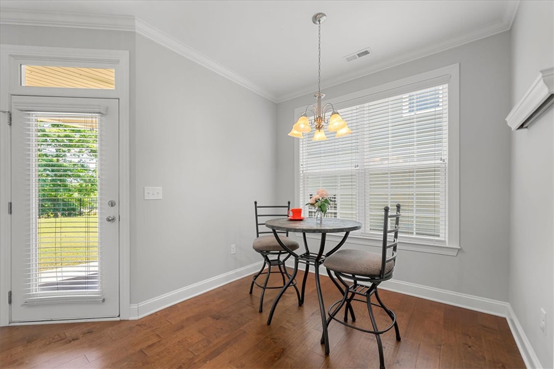 21 Barron Glenn Way Anderson, SC 29621 - Photo 21 of 48 This cozy breakfast nook features rich hardwood flooring and a charming light fixture, perfect for informal meals or other flexible options.