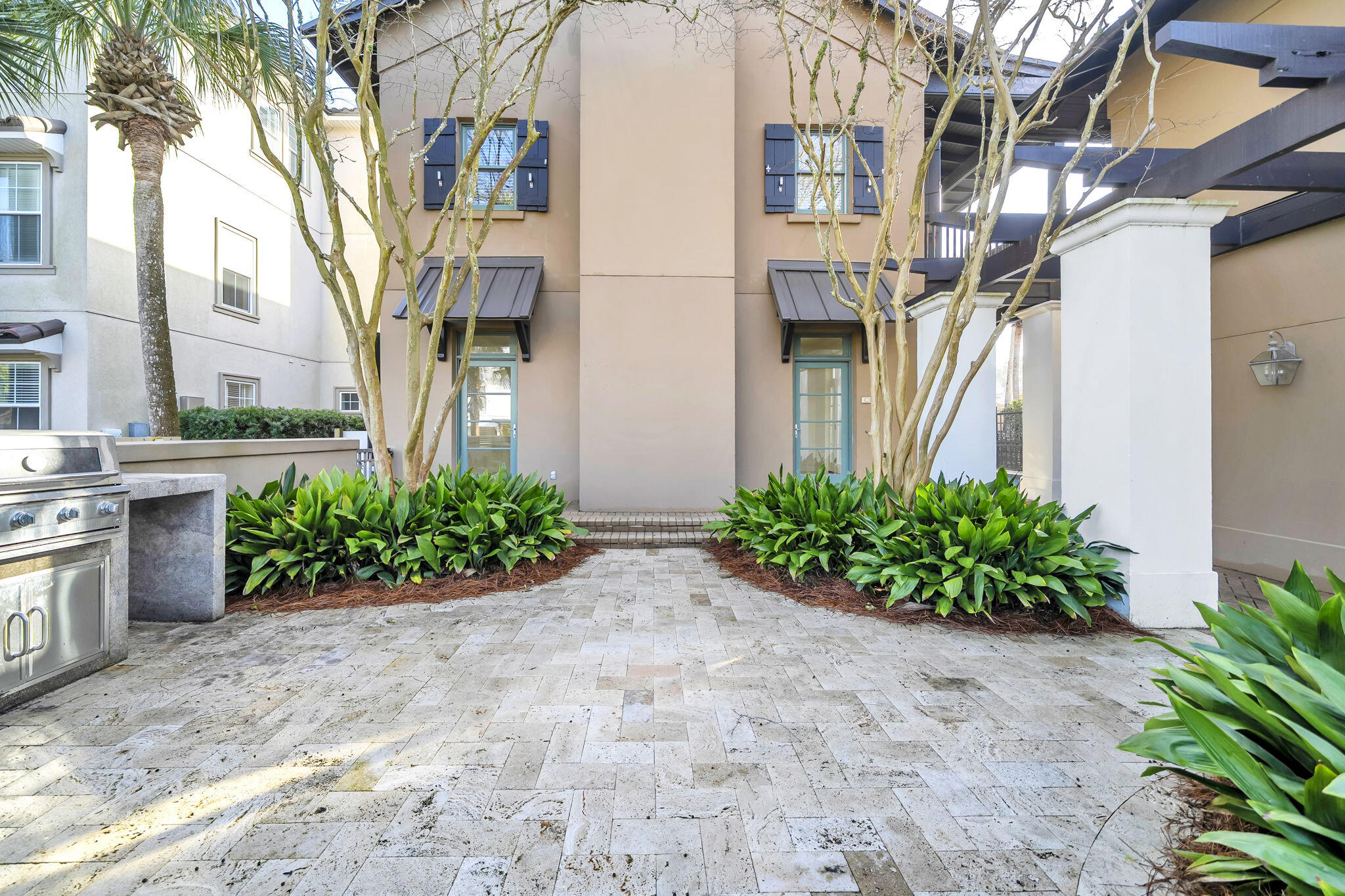 44 Tranquility Lane Destin, FL 32541 - Photo 11 of 82 a front view of a multi story residential apartment building with yard and bench
