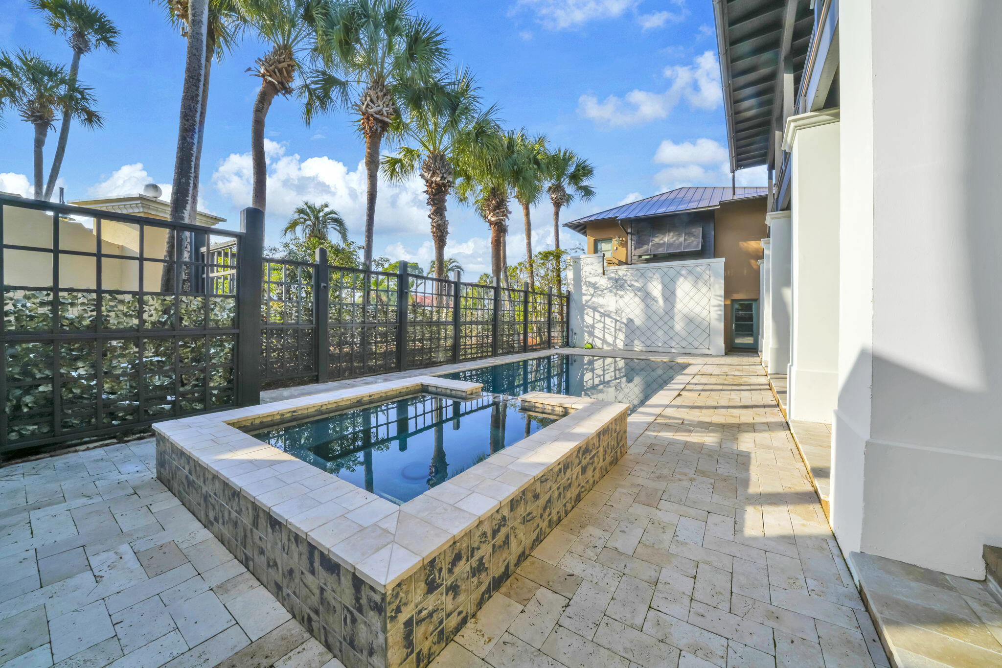 44 Tranquility Lane Destin, FL 32541 - Photo 15 of 82 a view of a roof deck with couches and wooden fence