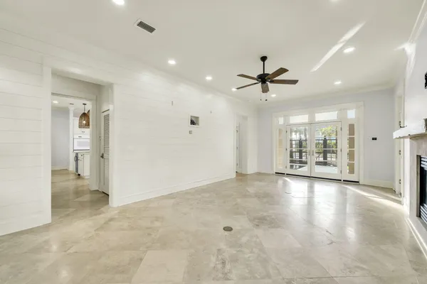 a view of an empty room with a window