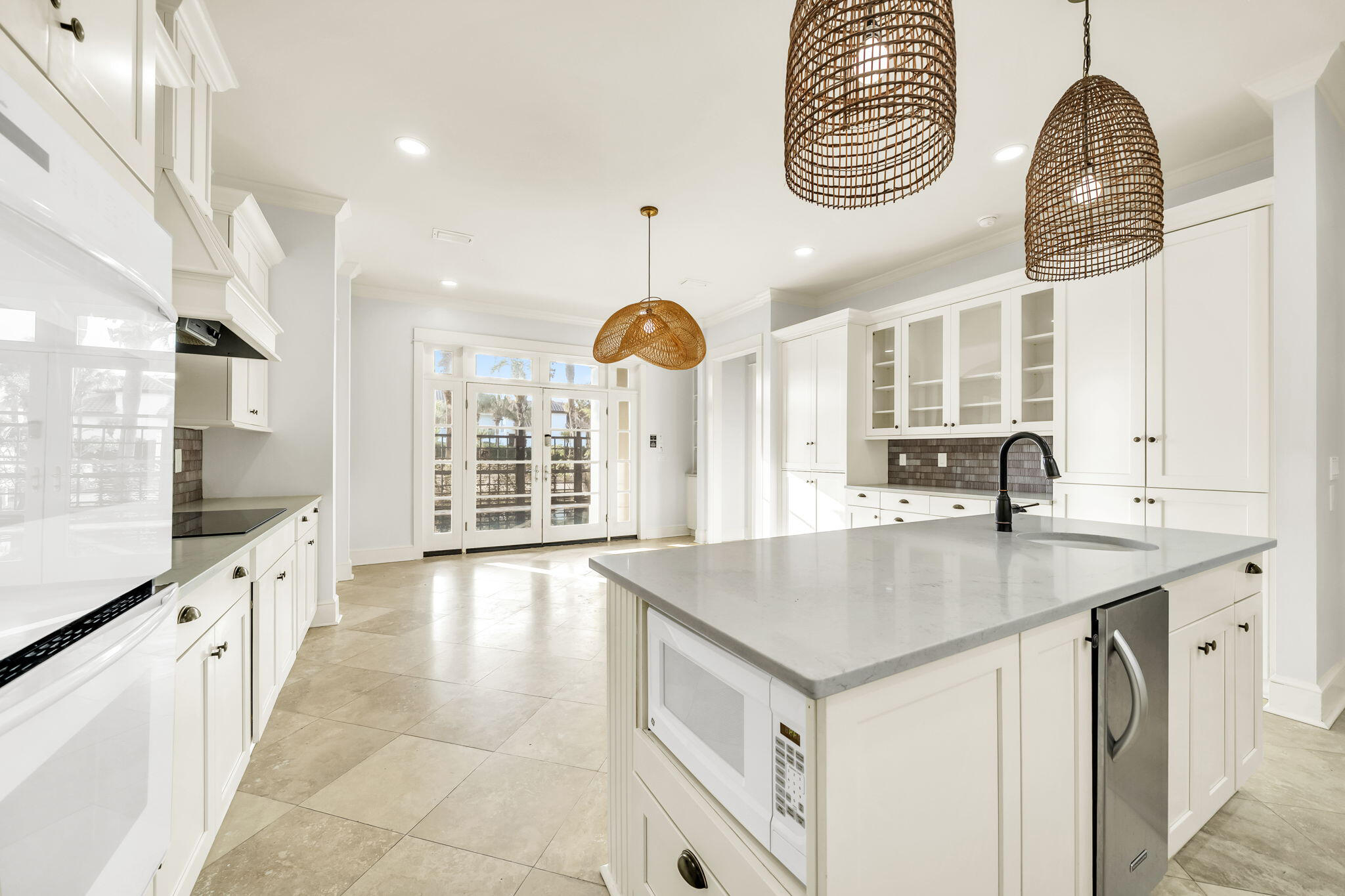 44 Tranquility Lane Destin, FL 32541 - Photo 33 of 82 a kitchen with stainless steel appliances granite countertop a sink a oven and a large window