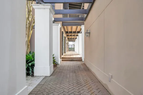 a view of a pathway with a house in front of it