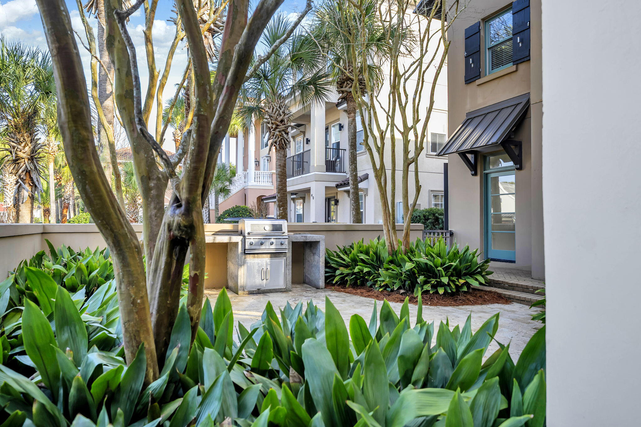 44 Tranquility Lane Destin, FL 32541 - Photo 6 of 82 a front view of a multi story residential apartment building with a yard