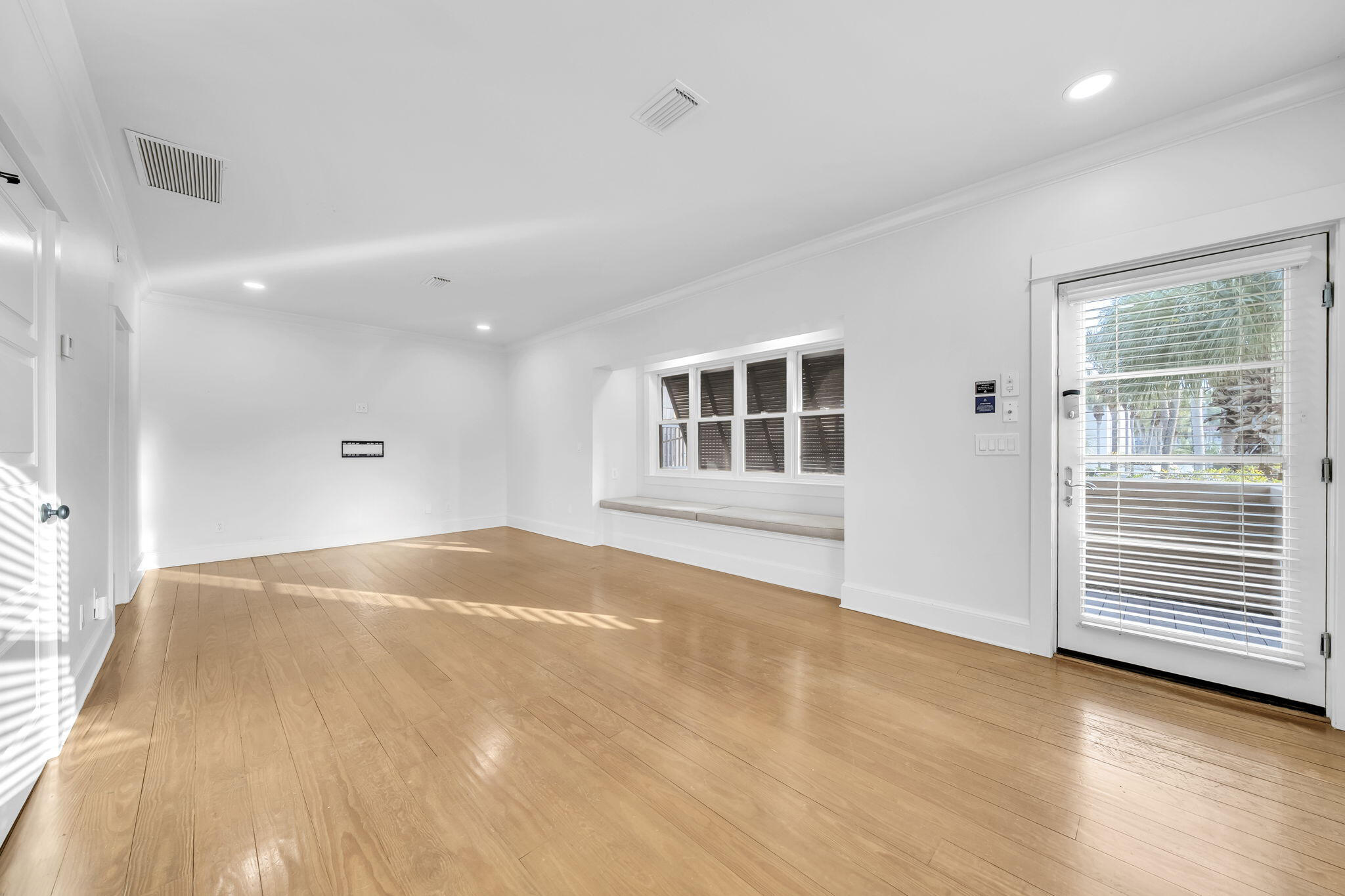 44 Tranquility Lane Destin, FL 32541 - Photo 72 of 82 a view of an empty room with wooden floor and a window