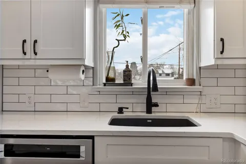 a kitchen with a sink and a window