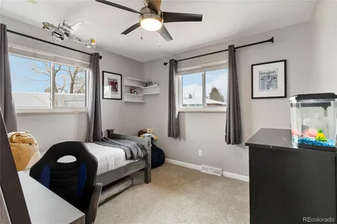 a bedroom with furniture and window