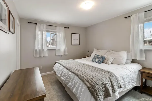 a bedroom with a bed and a view of bathroom