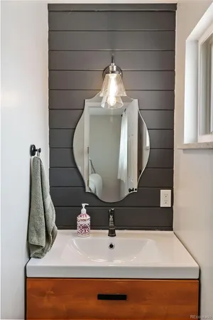 a bathroom with a sink and a mirror
