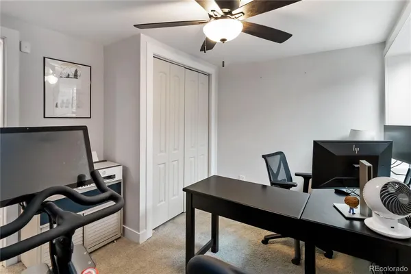 a workspace with furniture and a window