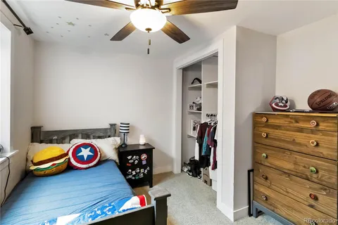 a bedroom with furniture and a window