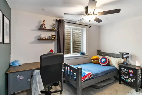 a view of a patio with table and chairs with wooden floor and fence