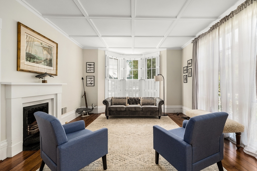 4 Linden Street Wenham, MA 01984 - Photo 16 of 27 a living room with furniture and a fireplace