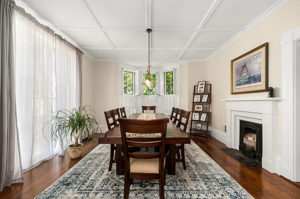 4 Linden Street Wenham, MA 01984 - Photo 18 of 27 a dining room with furniture a fireplace and wooden floor