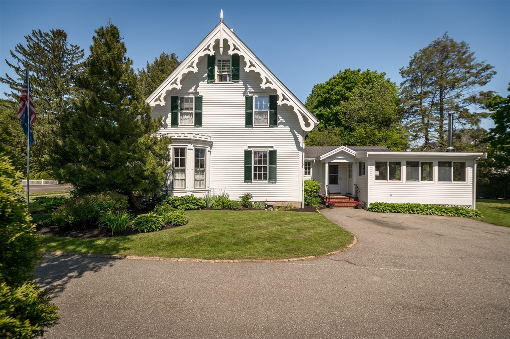 4 Linden Street Wenham, MA 01984 - Photo 4 of 27 a front view of a house with a yard