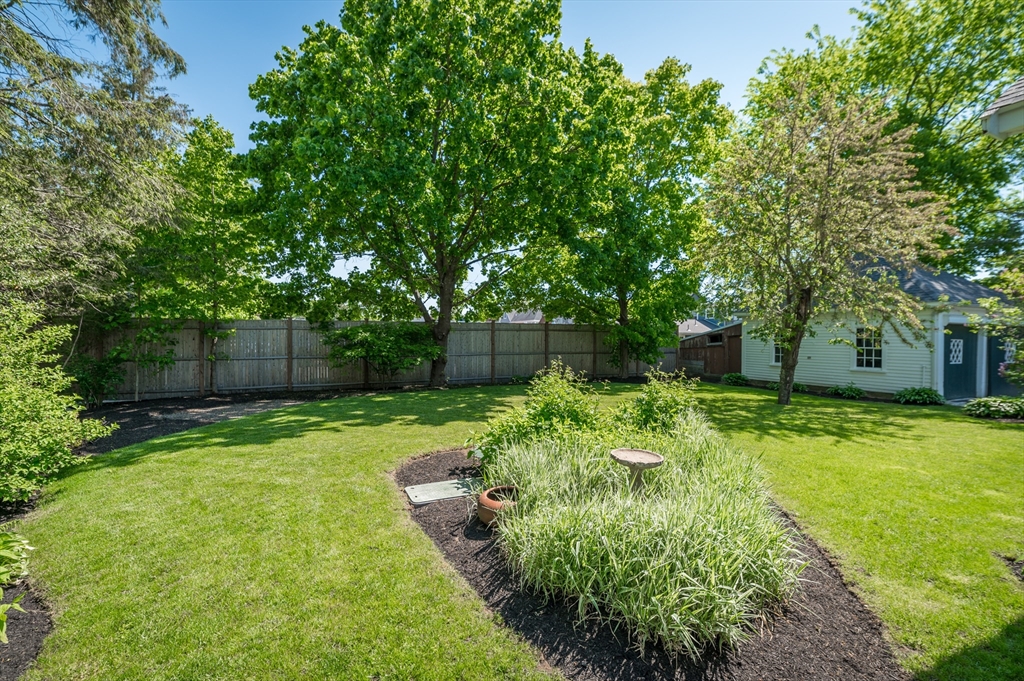 4 Linden Street Wenham, MA 01984 - Photo 7 of 27 a backyard of a house with a lots of green space