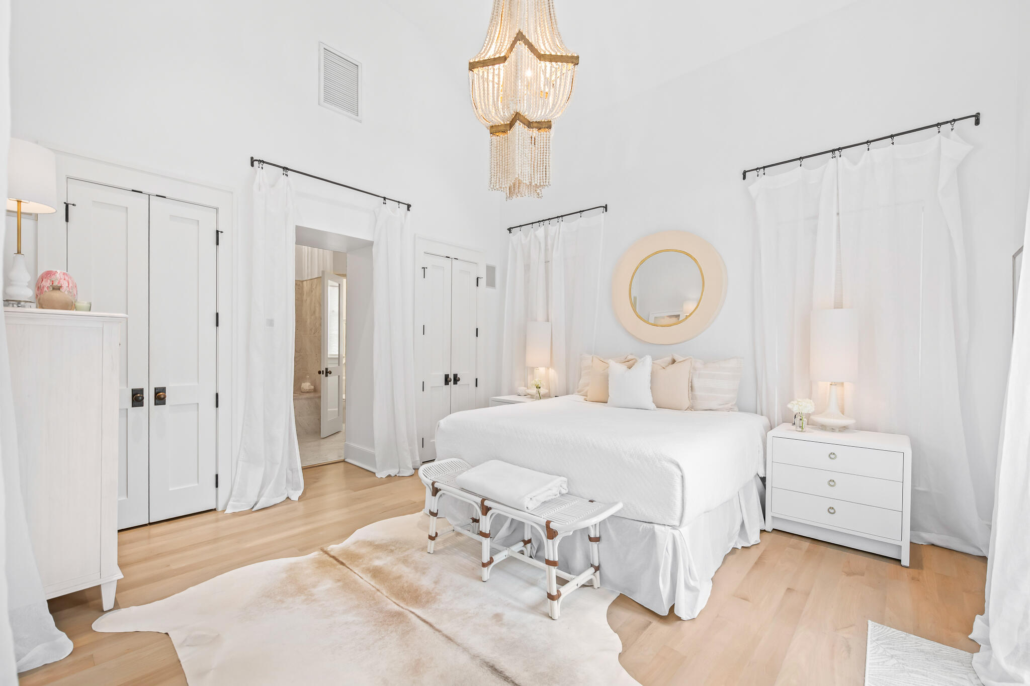 36 Seven Wells Court, Unit A4 Inlet Beach, FL 32461 - Photo 6 of 21 a bedroom with a bed and a chandelier