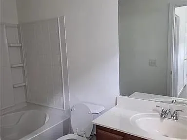 a bathroom with a sink and a toilet