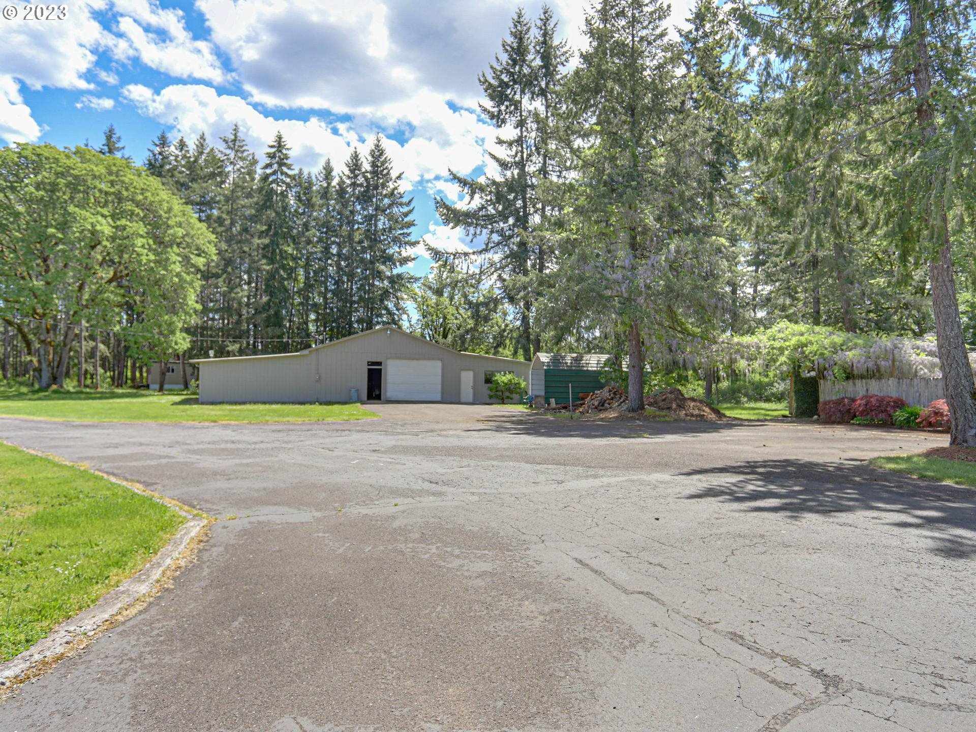 24347 Southeast Filbert Road Eagle Creek, OR 97022 - Photo 5 of 48 a front view of a house with a yard