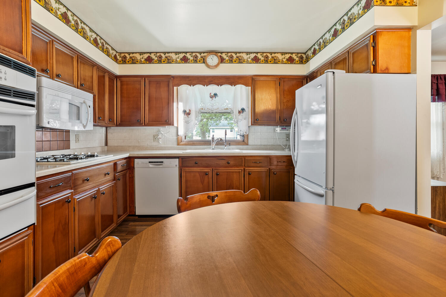 509 East Oak Street Chatsworth, IL 60921 - Photo 11 of 33 a kitchen with stainless steel appliances a sink and a refrigerator