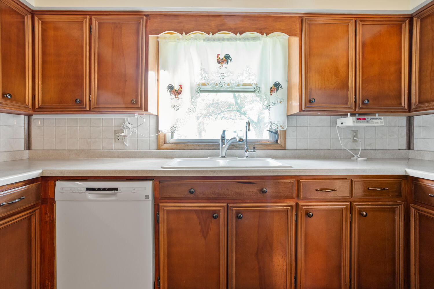 509 East Oak Street Chatsworth, IL 60921 - Photo 14 of 33 a view of a kitchen with a sink window and cabinets