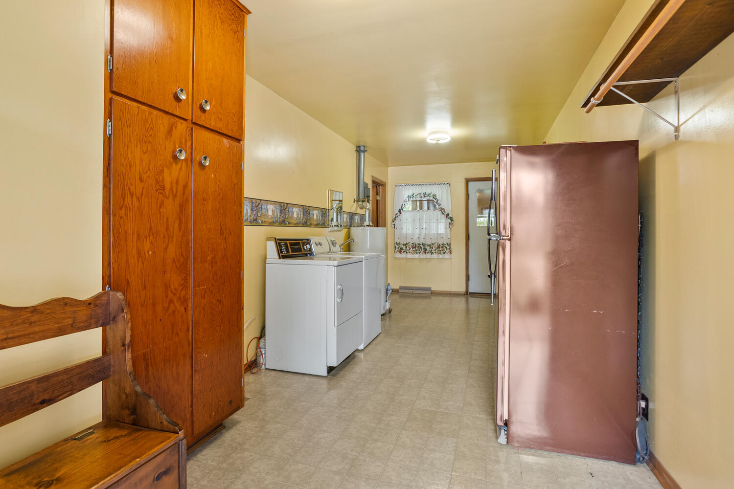 509 East Oak Street Chatsworth, IL 60921 - Photo 26 of 33 a view of a kitchen with refrigerator and wooden floor