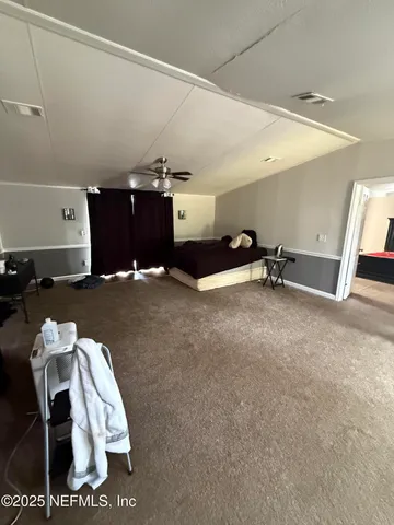 a kitchen with a sink appliances and cabinets