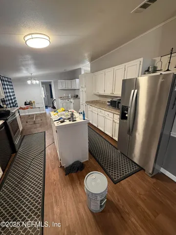 a bedroom with table and chairs