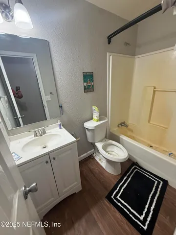 a bedroom with furniture and window