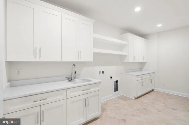 an empty room with windows and wooden floor