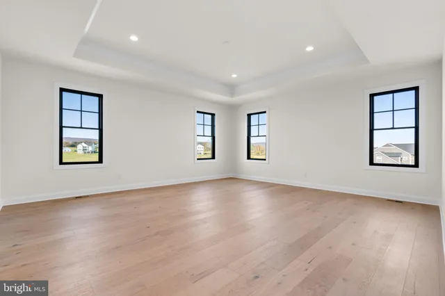 a view of balcony with wooden floor