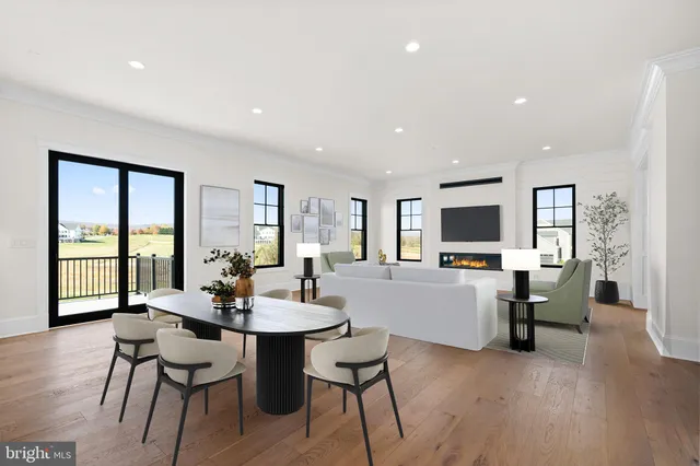 a large white kitchen with a large window