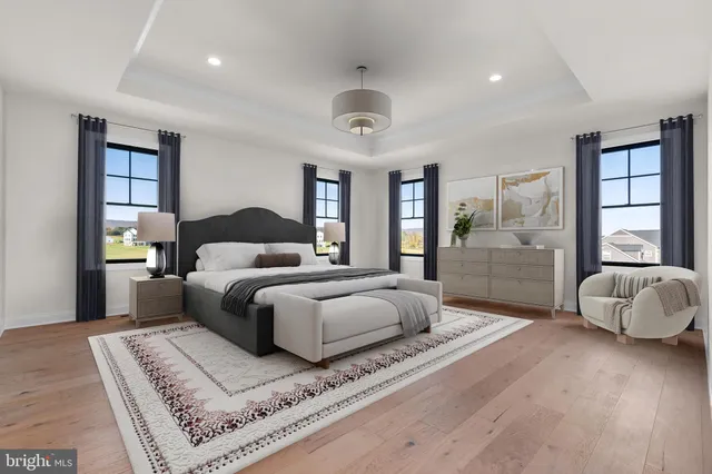 a large kitchen with kitchen island a large island a sink stainless steel appliances and cabinets